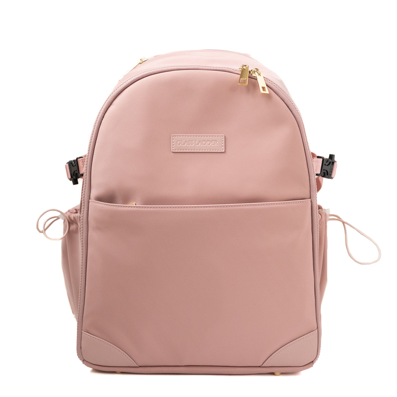 The Amanda Backpack by Glass Ladder, in Pink Mimosa, features a sleek design with gold zippers. It offers a front pocket, two side pockets, and a stitched front label. Measuring L 12 x W 6 x H 15, it has adjustable straps and a top handle for easy carrying. Pre-order now for shipping in early May.