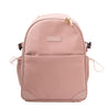 The Amanda Backpack by Glass Ladder, in Pink Mimosa, features a sleek design with gold zippers. It offers a front pocket, two side pockets, and a stitched front label. Measuring L 12 x W 6 x H 15, it has adjustable straps and a top handle for easy carrying. Pre-order now for shipping in early May.
