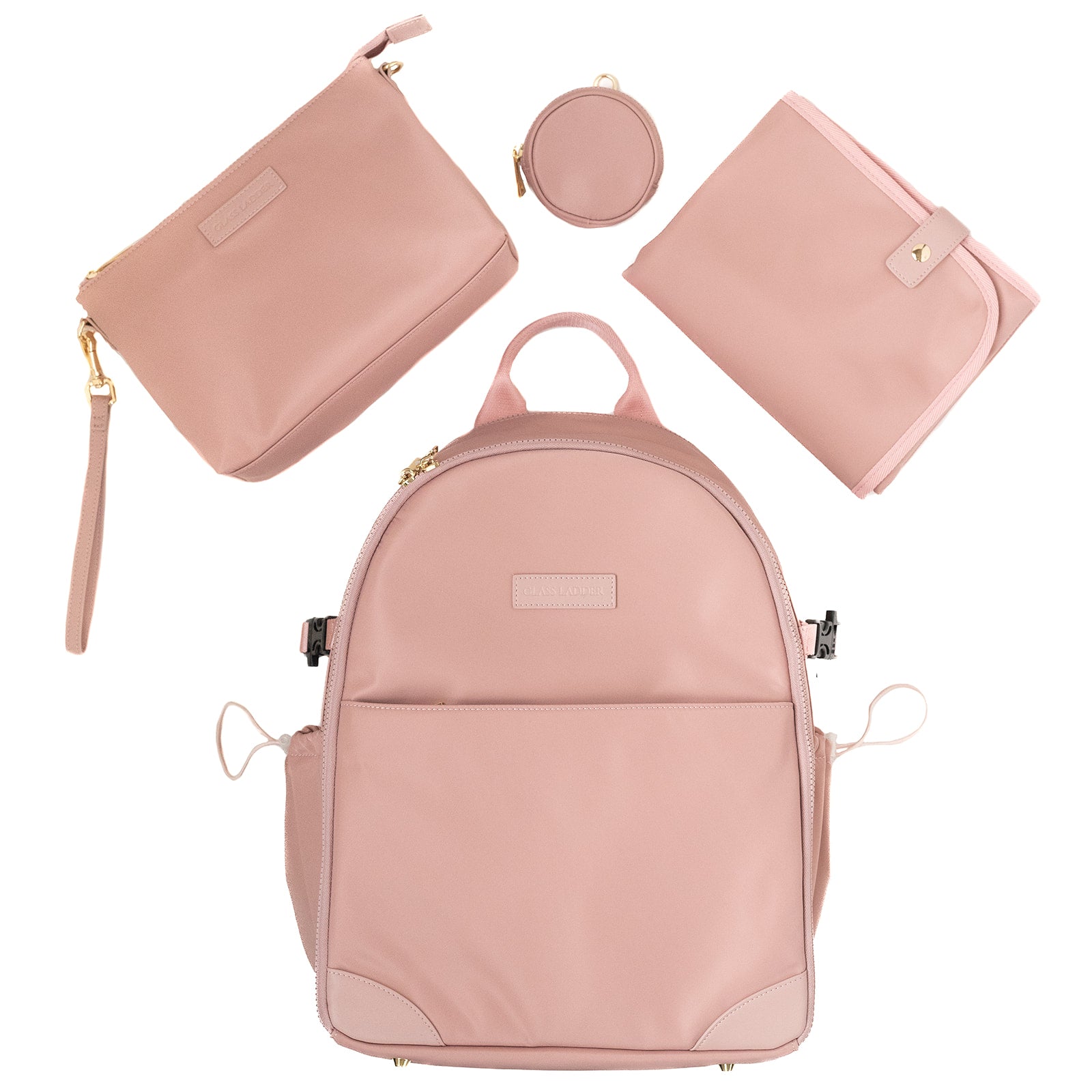 The Amanda Backpack in Pink Mimosa by Glass Ladder features matching accessories: a handbag, circular pouch, and foldable changing mat. Styled with gold-tone hardware and measuring L 12 x W 6 x H 15, it offers elegant functionality against a white backdrop. Pre-order now to ship early May.